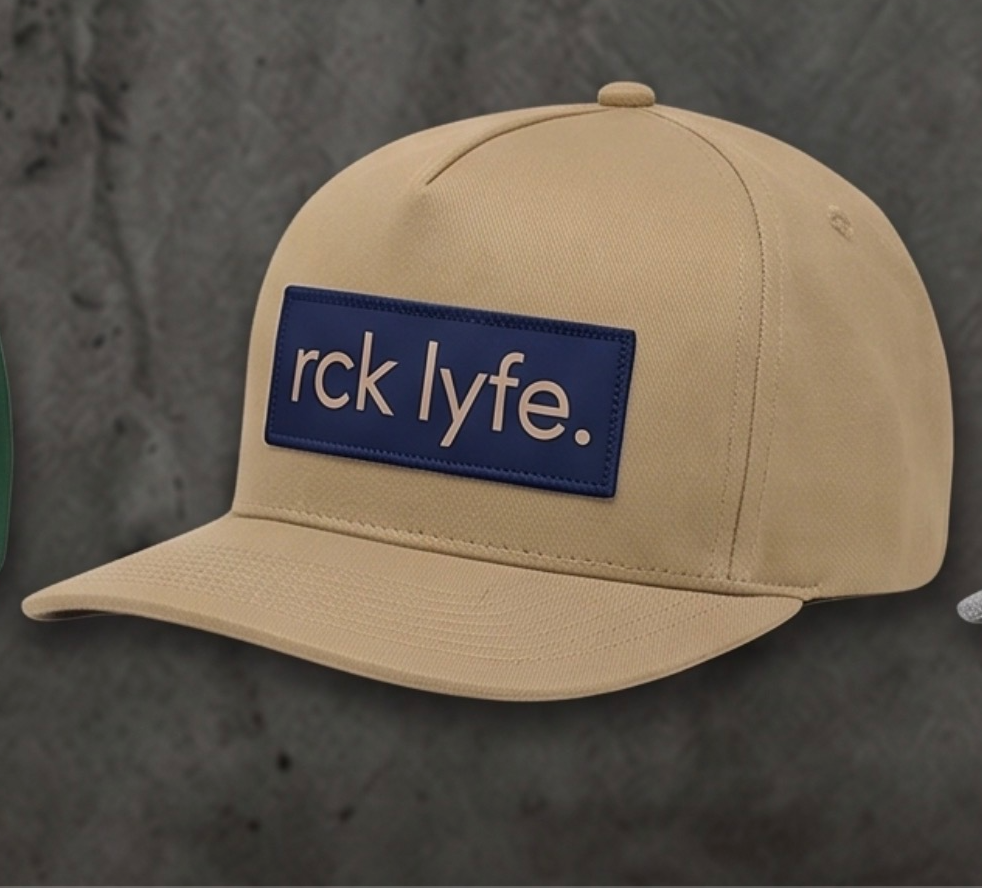 Beige RCK Lyfe 5-panel snapback with navy patch and cream rck lyfe. logo