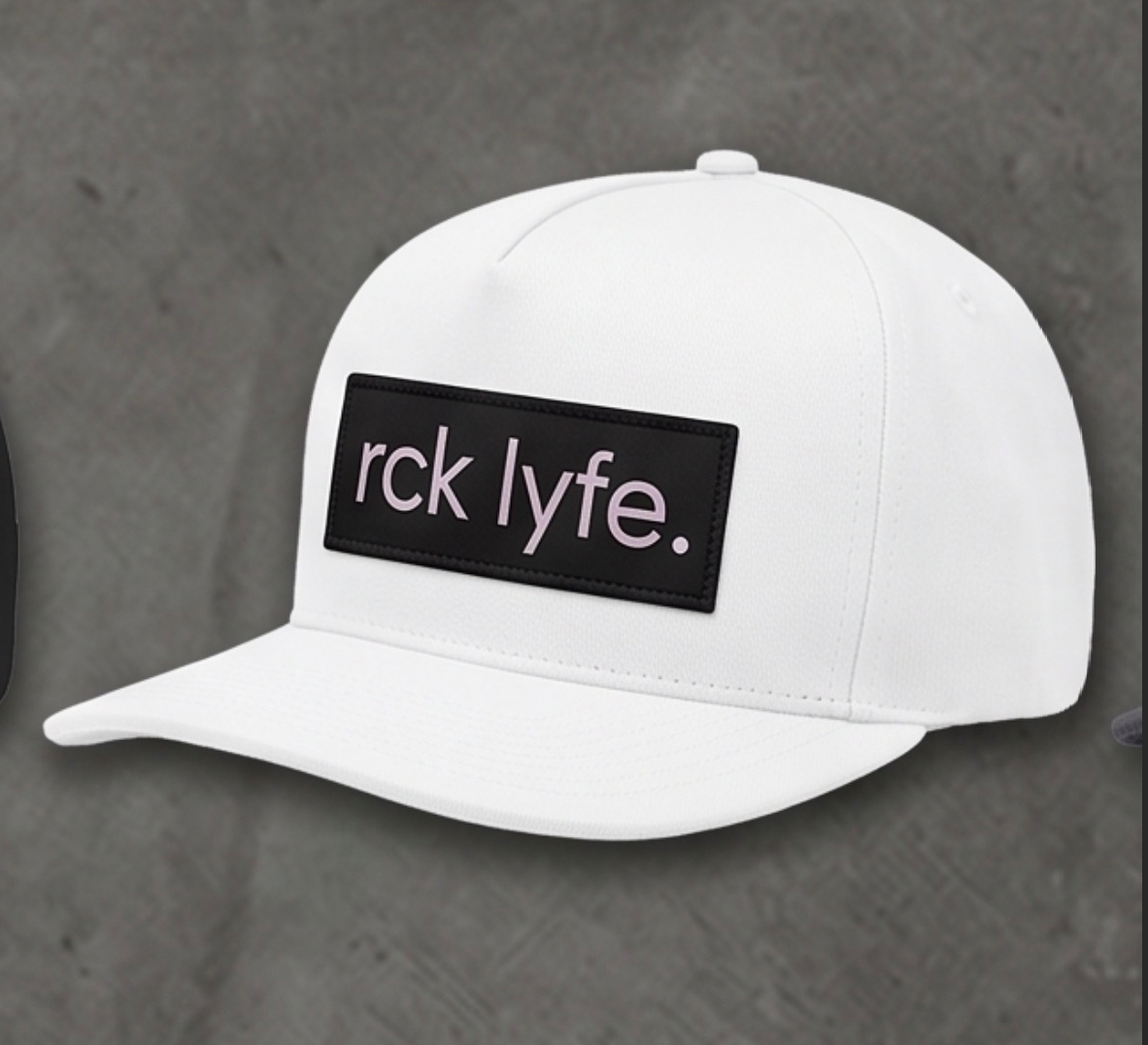 White RCK Lyfe 5-panel snapback with black patch and pink rck lyfe. logo